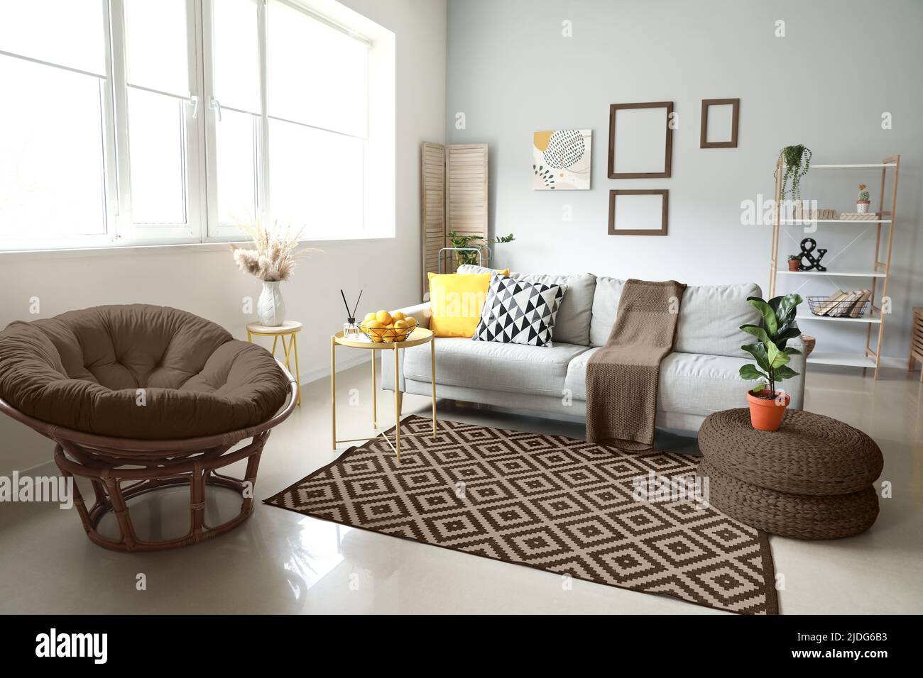 Interior of modern living room with sofa, table and papasan chair Stock  Photo - Alamy