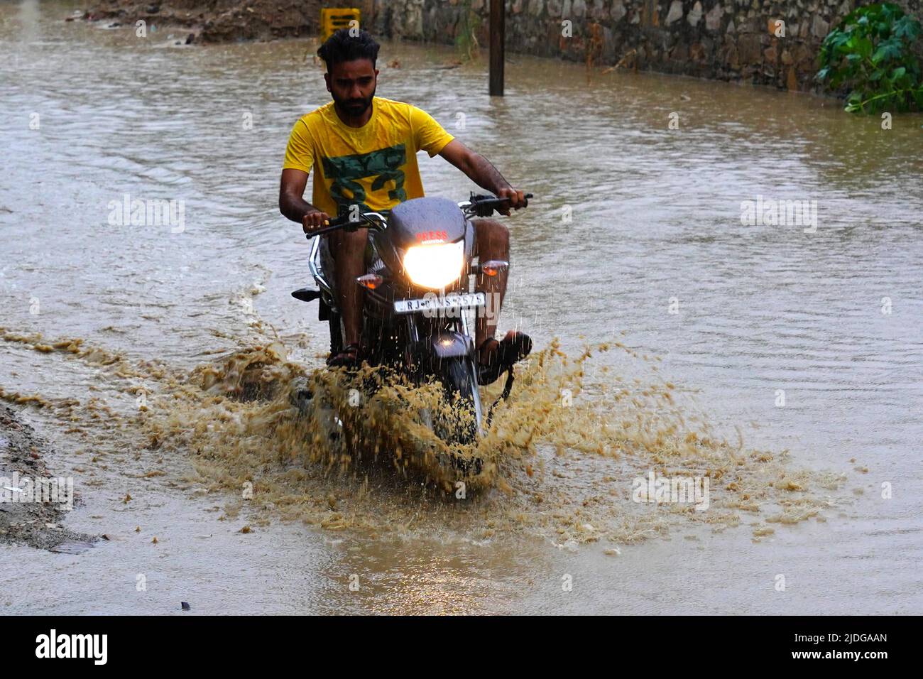 Rajasthan India On June 20 2022 Indian People Make Their Way Through A Waterlogged Road After