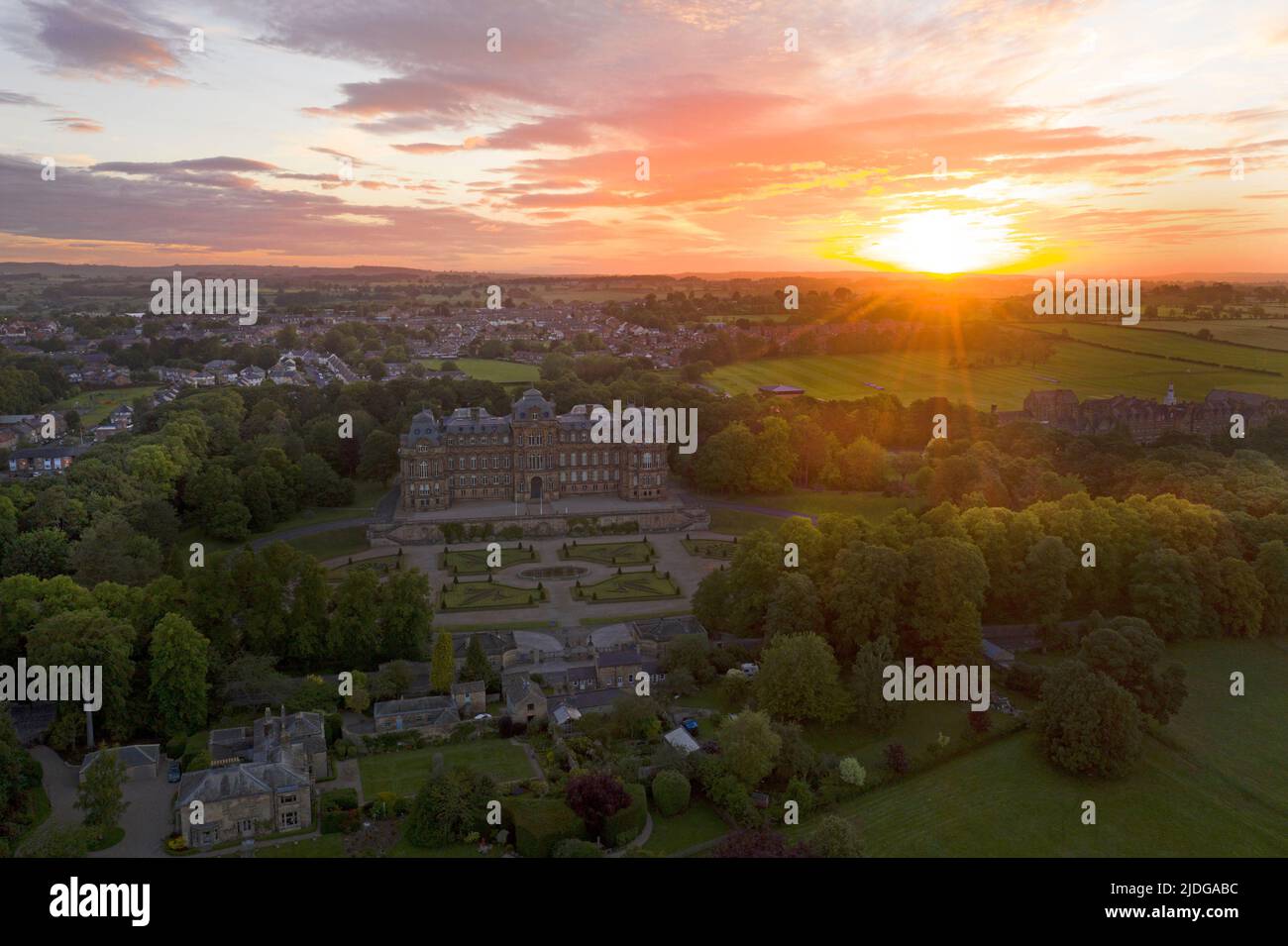 Barnard Castle, Teesdale, County Durham, UK.  21st June 2022. UK Weather. A beautiful summer solstice sun rises over the spectacular French style chateau of the Bowes Museum in Barnard Castle this morning. Credit: David Forster/Alamy Live News Stock Photo