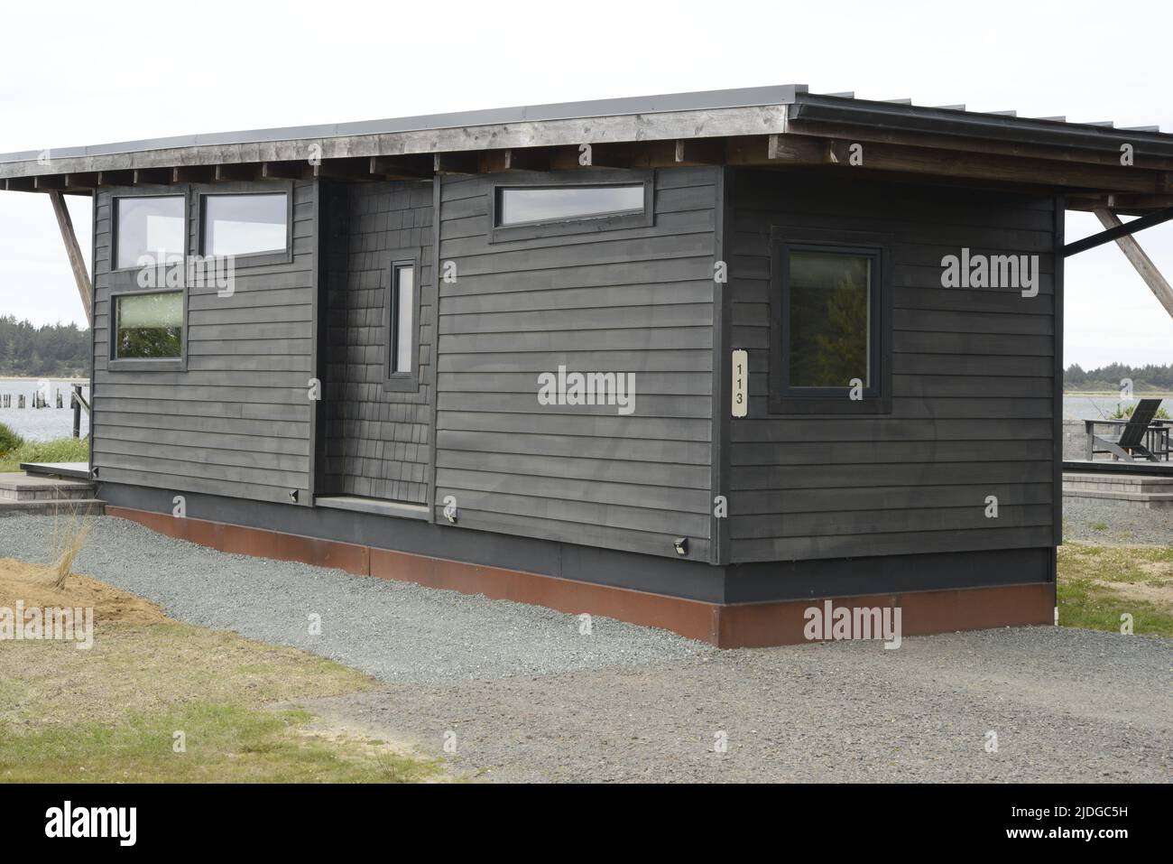 Scenic Beach Tiny Homes - Coastal Living  Modern Beach Home Off Grid in Pacific Northwest Architecture Stock Photo