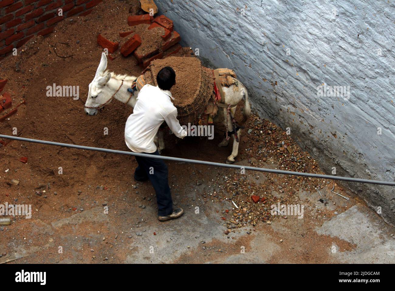 a worker doing work on construction site Stock Photo