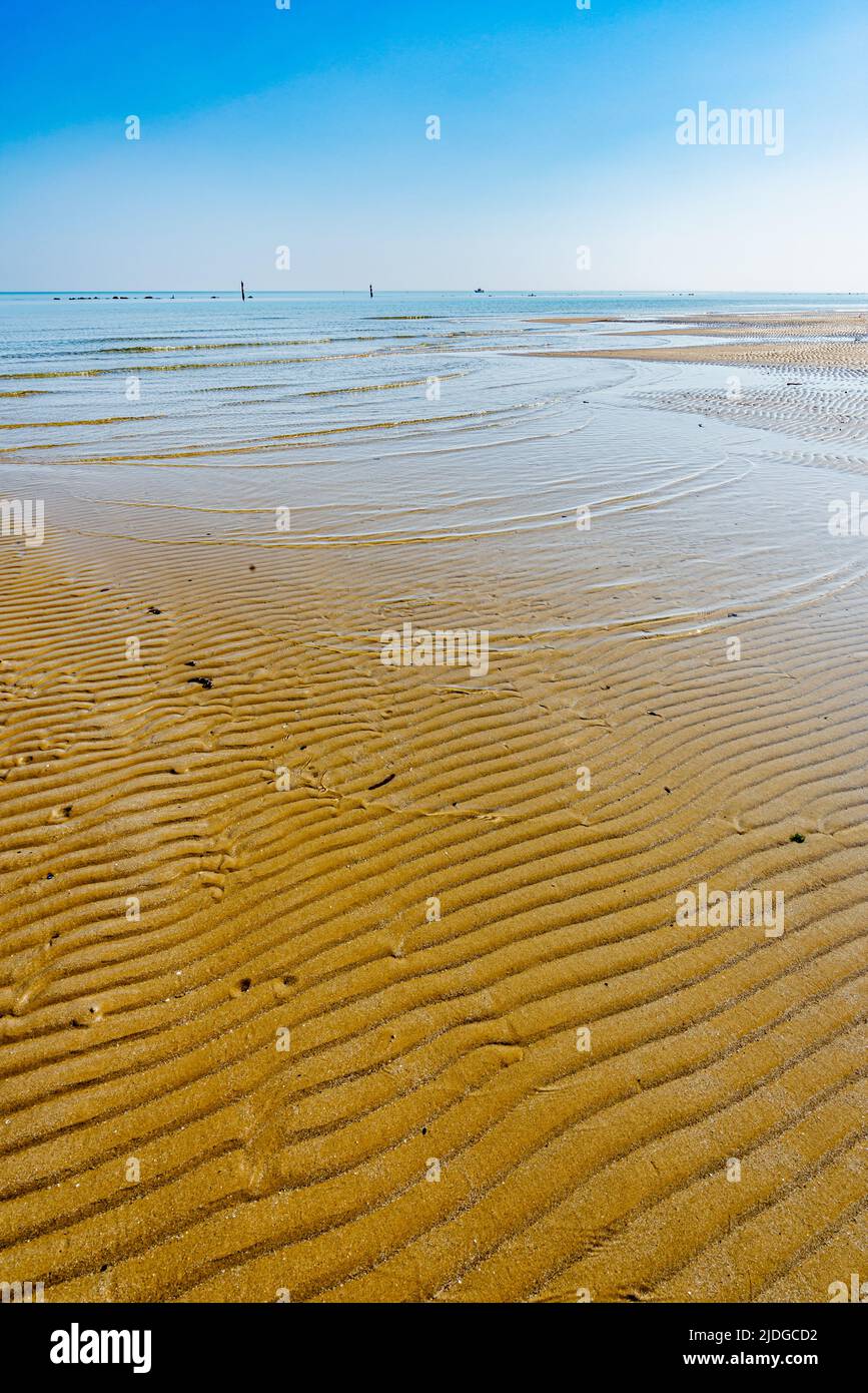 View of the Adriatic Sea from the sandy beach in Pesaro, Italy, during a sunny spring day Stock Photo