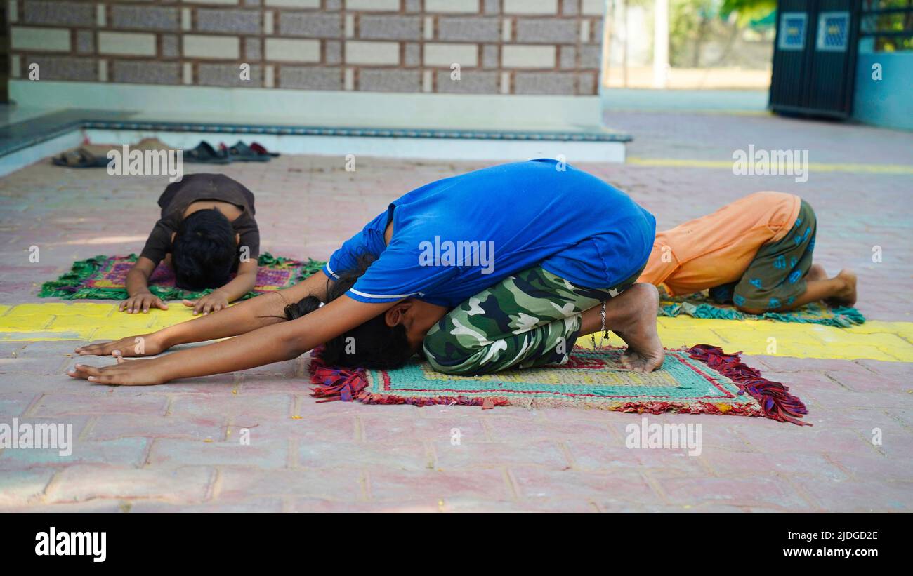 Asian Girl doing gymnastic exercises or exercising in fitness class with little siblings. Sport concept. Healthy lifestyle. Active hobbies Stock Photo