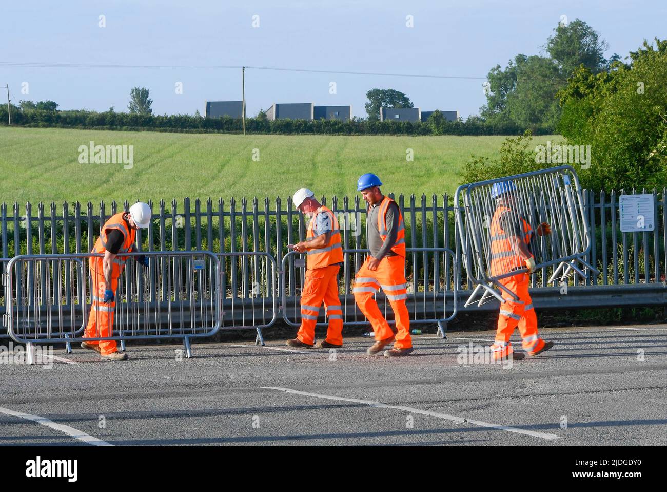 Castle Cary, Somerset, UK.  21st June 2022.  Railway staff at Castle Cary Station in Somerset setting up barriers for the influx of crowds going to Glastonbury Festival on the first day of the RMT rail strike.  The first train in today with festivalgoers is expected around midday.  Picture Credit: Graham Hunt/Alamy Live News Stock Photo