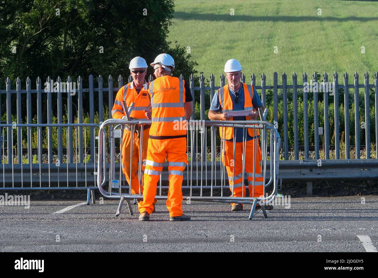 Castle Cary, Somerset, UK.  21st June 2022.  Railway staff at Castle Cary Station in Somerset setting up barriers for the influx of crowds going to Glastonbury Festival on the first day of the RMT rail strike.  The first train in today with festivalgoers is expected around midday.  Picture Credit: Graham Hunt/Alamy Live News Stock Photo