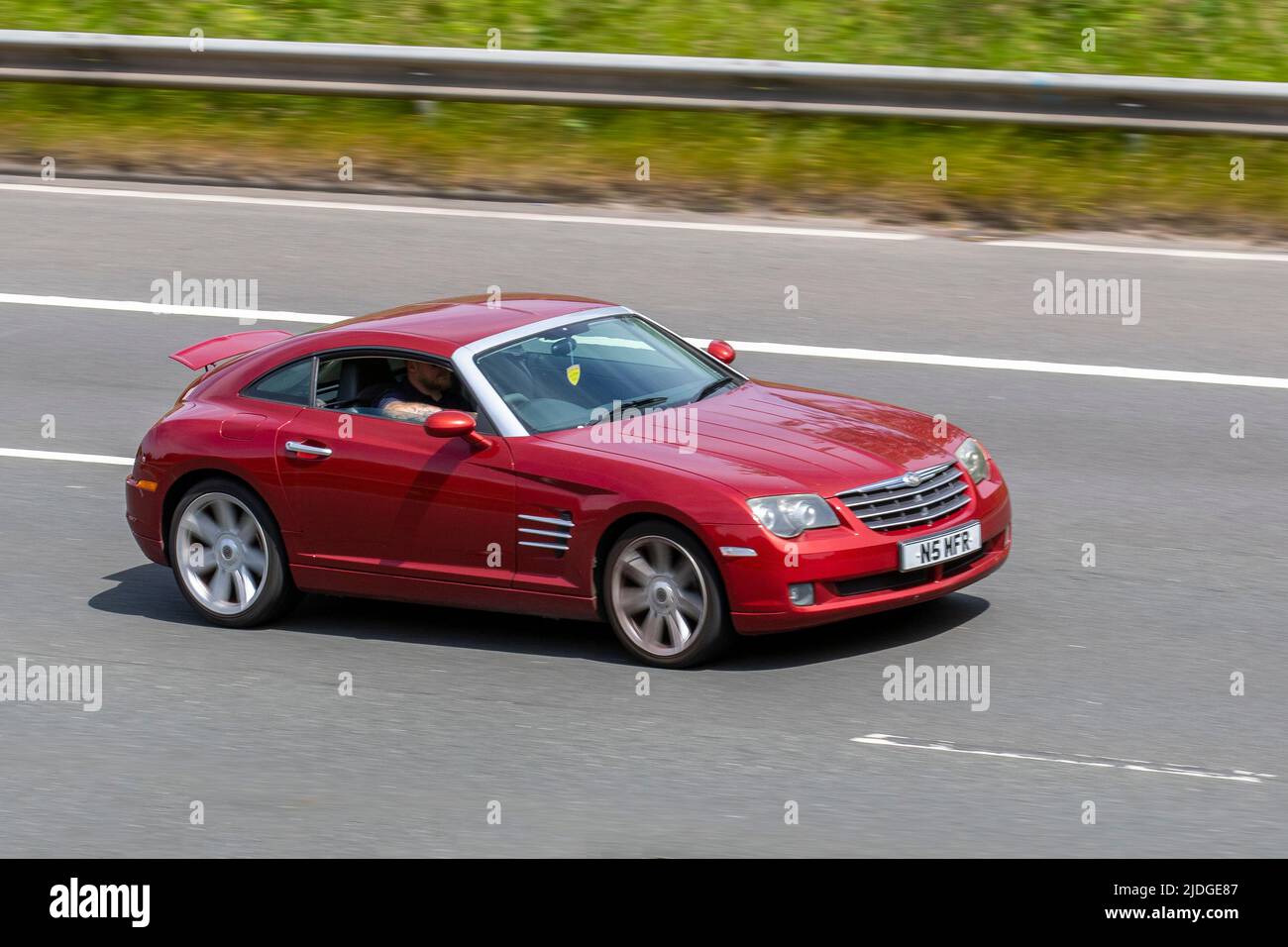 2004 CHRYSLER CrossFire V6 3199cc petrol 5 speed automatic; driving on the M6 Motorway, Manchester, UK Stock Photo