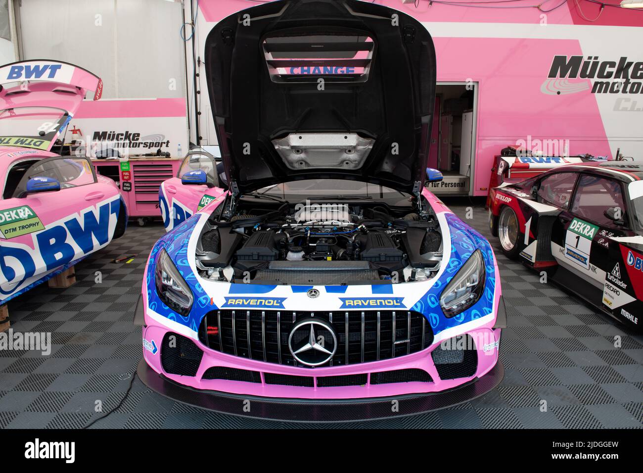 Mercedes AMG GT racing pink super car in box circuit, open hood.and visible engine Imola, Italy, june 17 2022. DTM Stock Photo