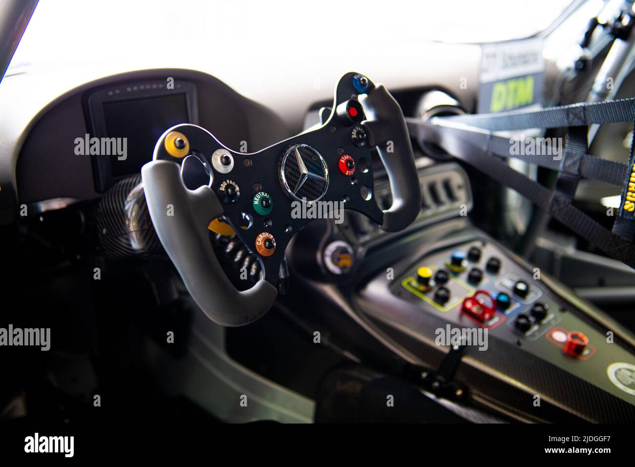 Car racing steering wheel in Mercedes AMG GT car cockpit detail no people. Imola, Italy, june 17 2022. DTM Stock Photo