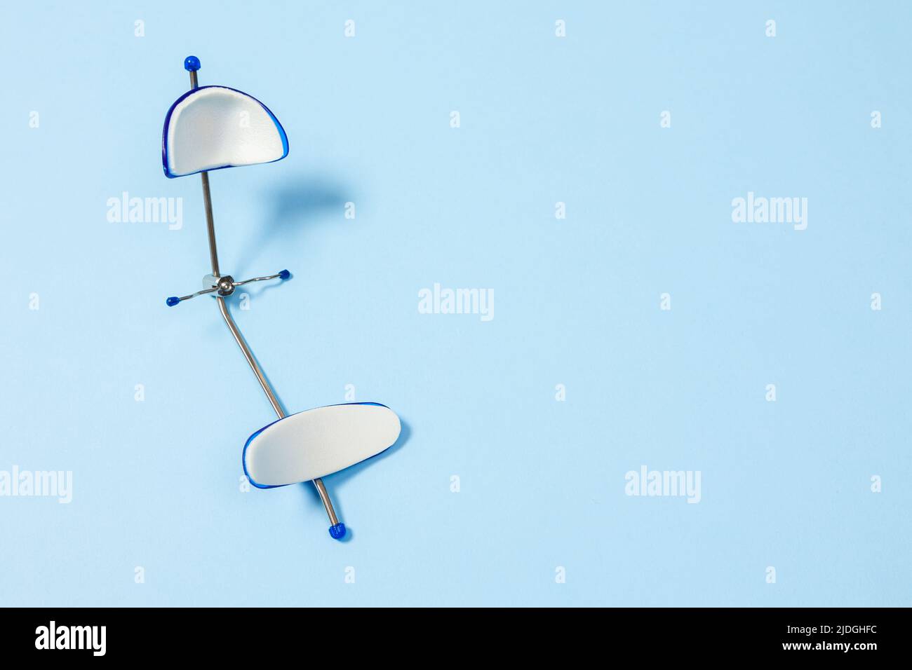 Orthodontic face mask Dental Petite Mask on a blue background special equipment for the dentist