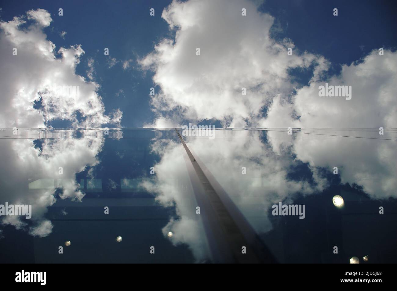 Sky clouds reflected in modern building hi-res stock photography and ...