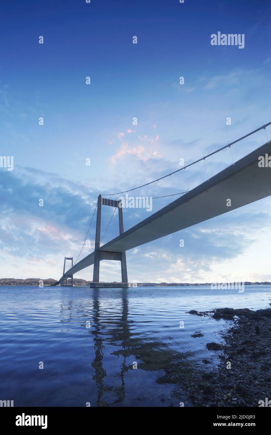 Lillebaelt bridge in Denmark standing tall in the sunset in beautiful colors Stock Photo