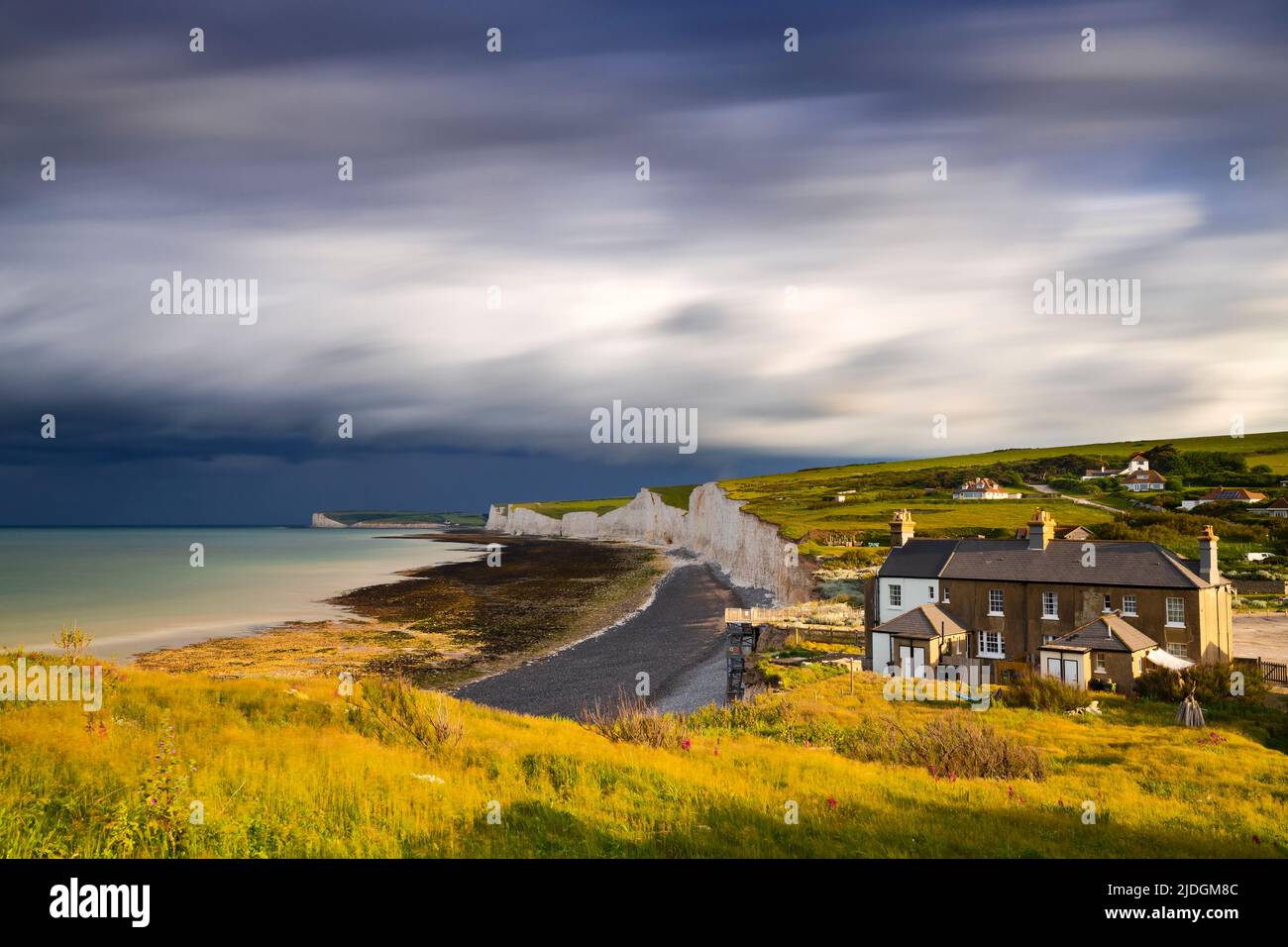 Sunrise and storm clouds at Birling Gap and the Seven Sisters, Eastbourne, Beachy Head, East Sussex, United Kingdom, Northern Europe Stock Photo