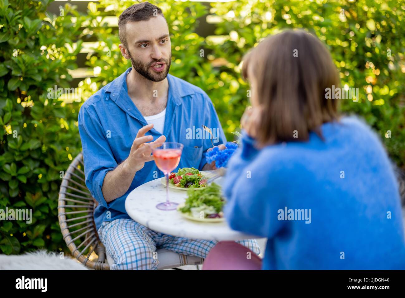 Stylish couple spend romantic evening at backyard Stock Photo