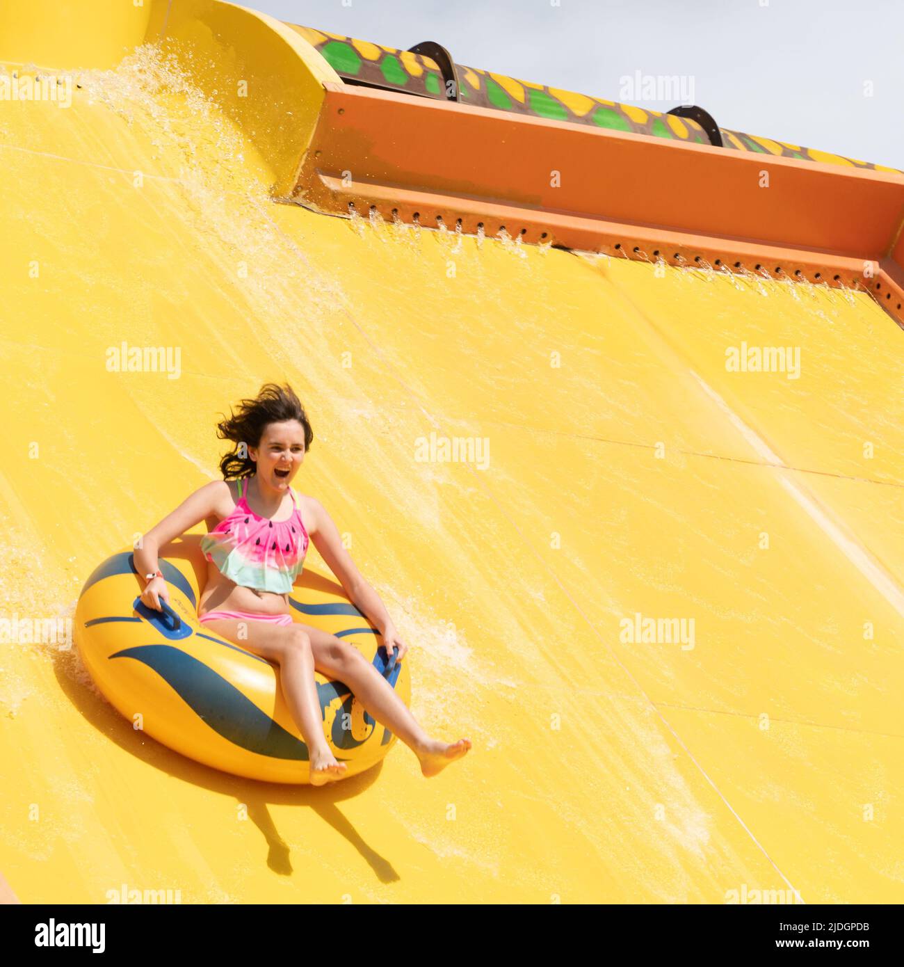 Girl on Water Slide Stock Photo