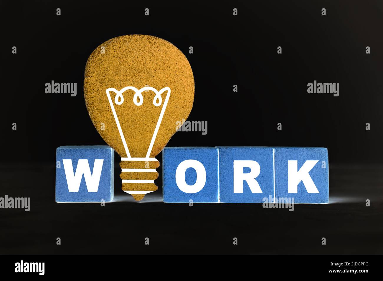 Lettering WORK made from wooden blocks and a flat lightbulb shape on ...