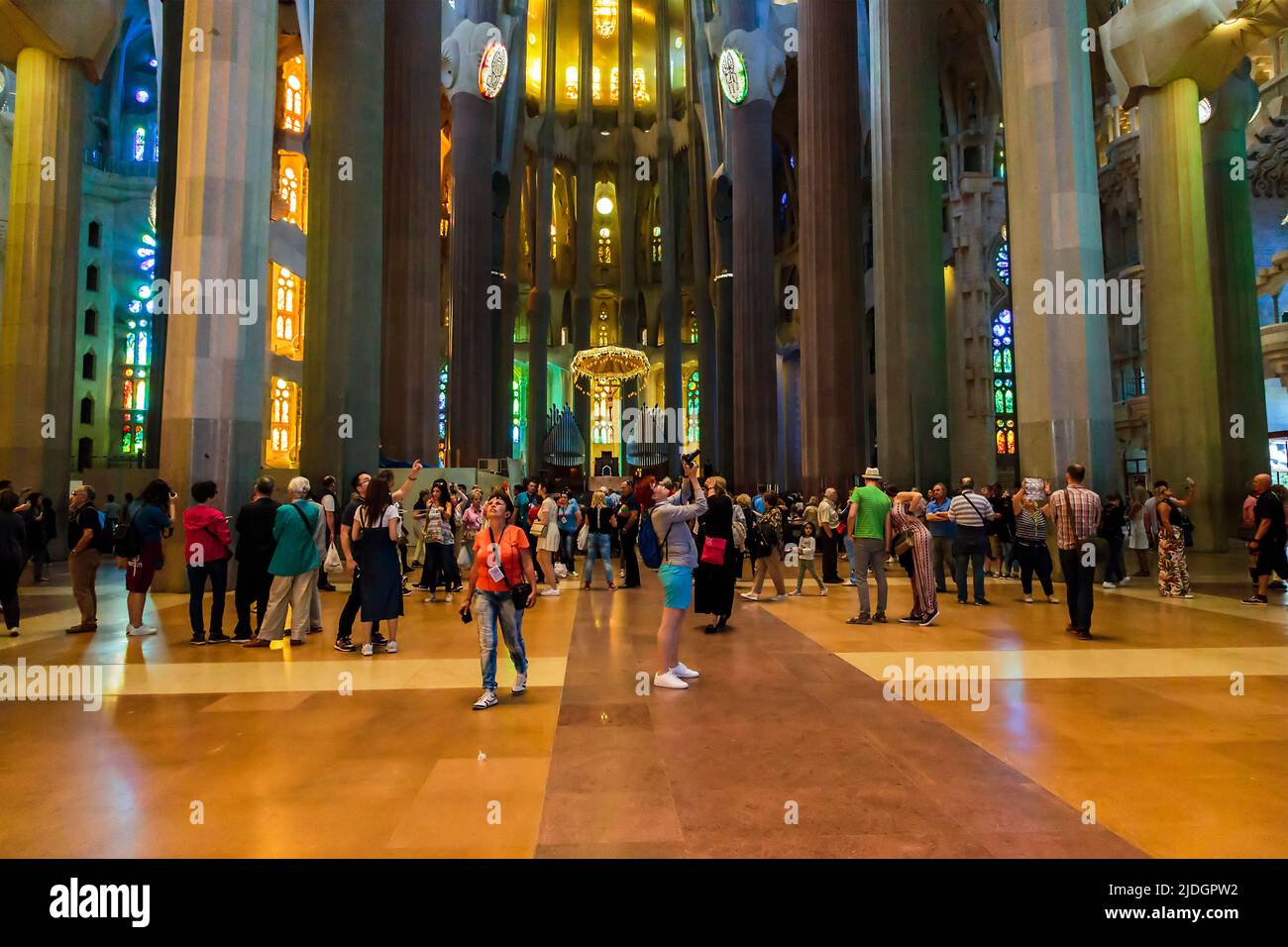 BARCELONA, SPAIN - MAY 16, 2017: Tourists are visiting the interior of the Sagrada Familia. Stock Photo