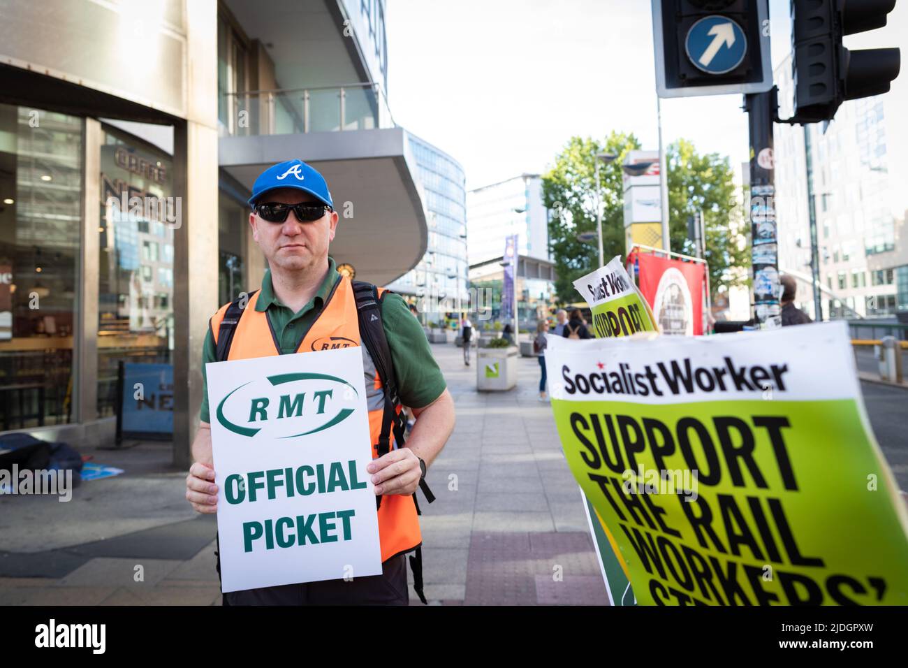 Manchester, UK. 21st June, 2022. A union member holds placard and joins the picket line at Piccadilly train station. The biggest rail strike in over 30 years went ahead after last-minute talks failed. RMT states it has no choice but to strike due to proposed cuts to jobs, pay and pensions. Credit: Andy Barton/Alamy Live News Stock Photo