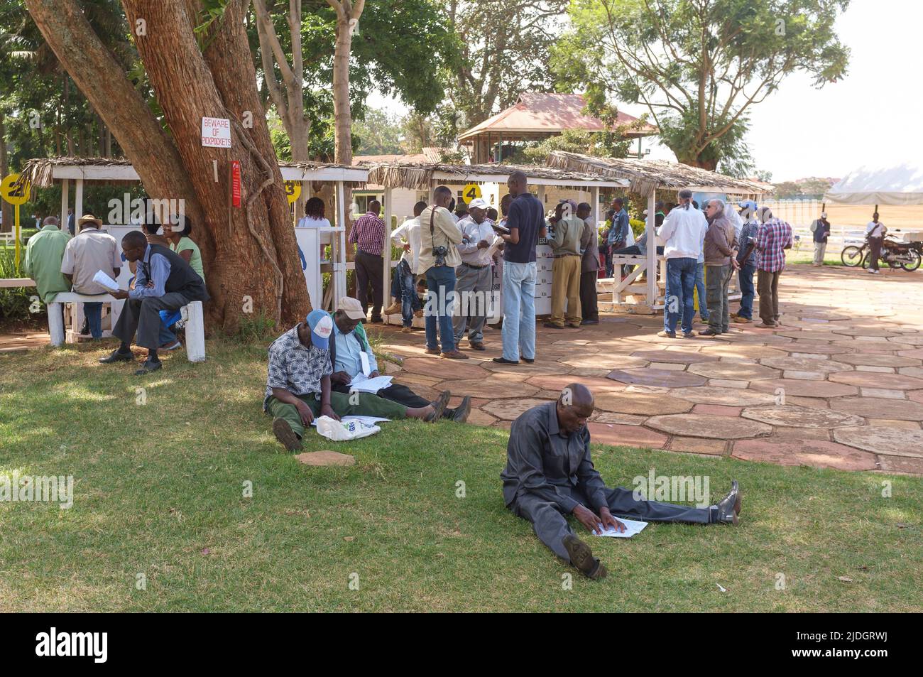 Spectators studying the racing odds, Ngong Racecourse, Ngong Road, Nairobi, Kenya.  1 Mar 2015 Stock Photo