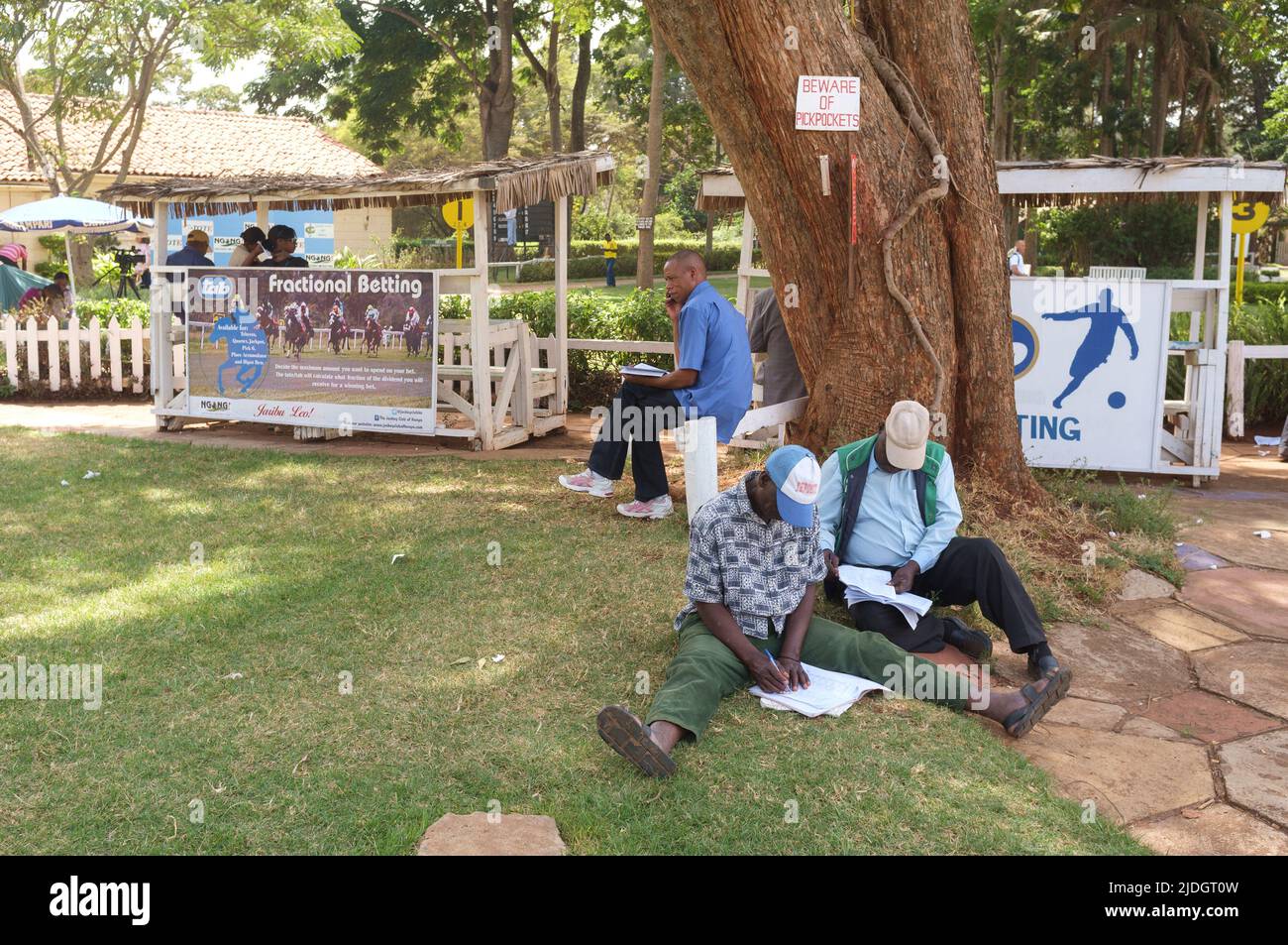 Spectators studying the racing odds, Ngong Racecourse, Ngong Road, Nairobi, Kenya.  1 Mar 2015 Stock Photo