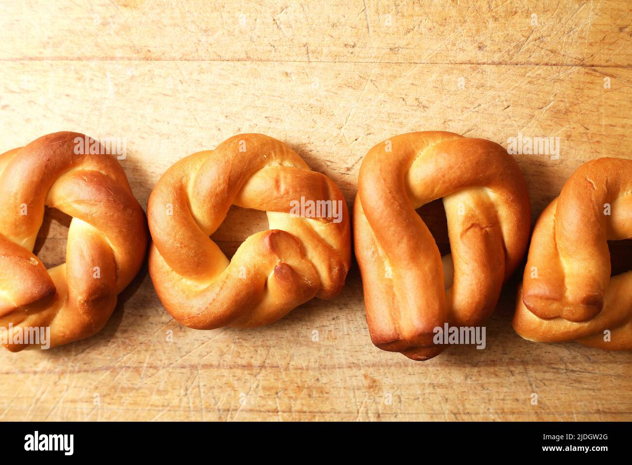 Few freshness bagels on old wooden background with free space Stock Photo