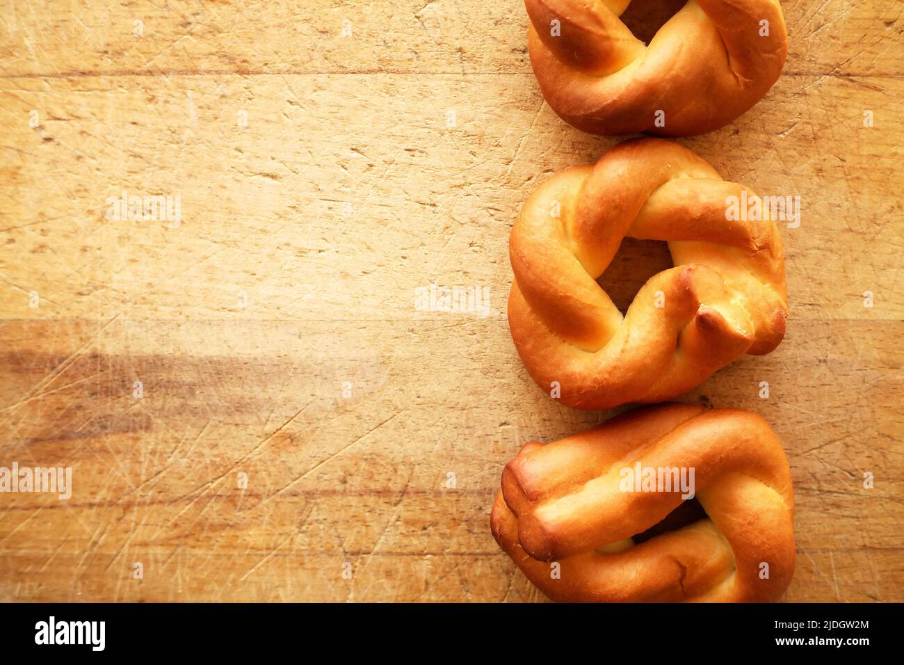 Few freshness bagels on old wooden background with free space Stock Photo