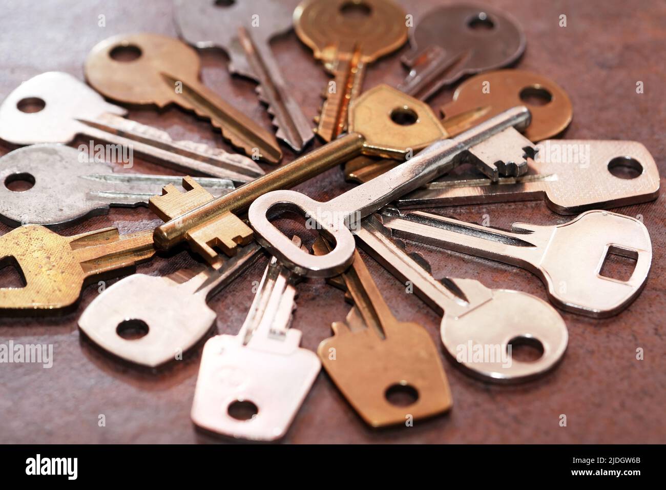 Set of various old keys closeup on brown background Stock Photo