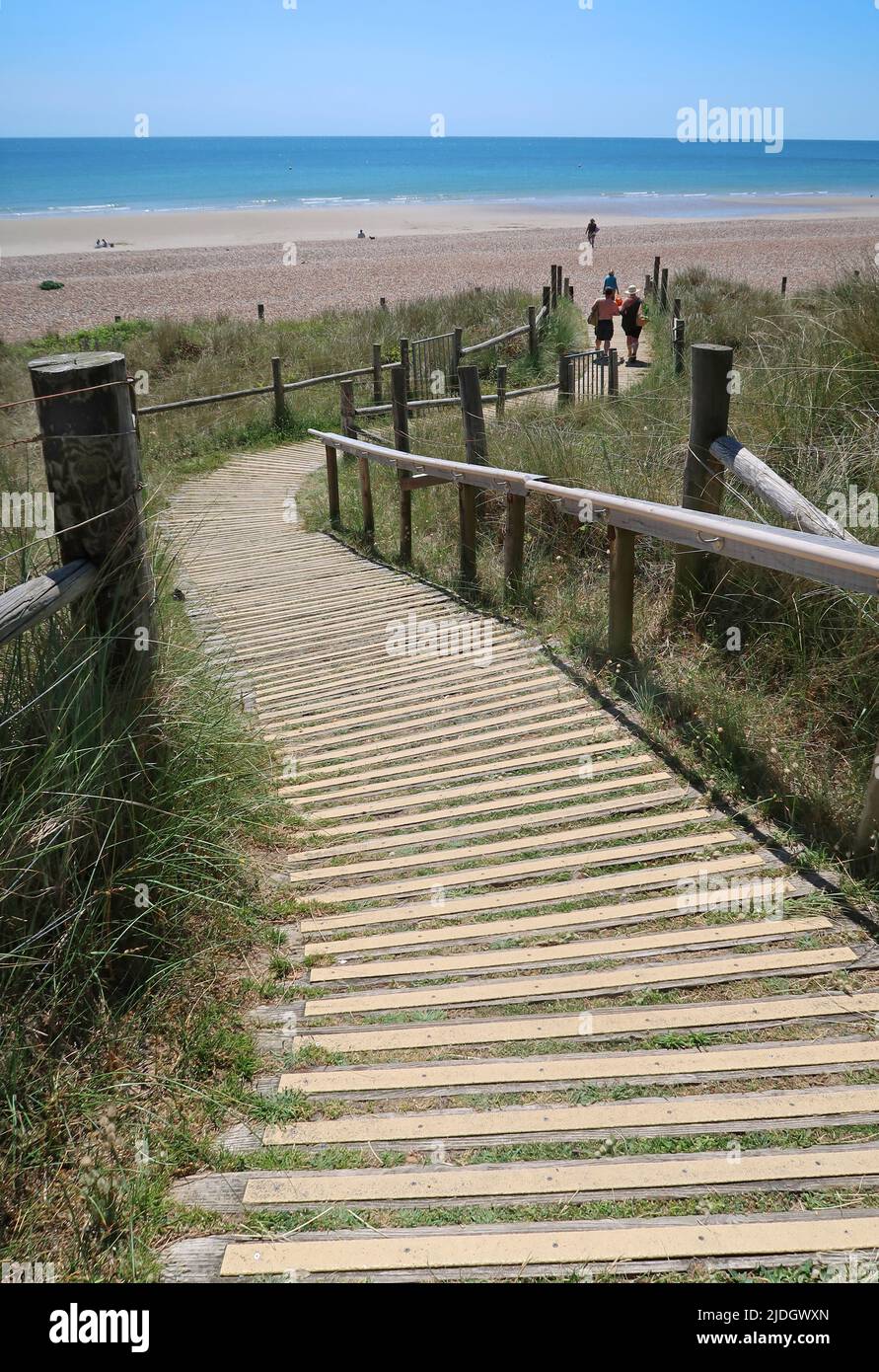 Littlempton, West Sussex, UK. A boarded footpath runs through the sand dunes behind West beach. Stock Photo