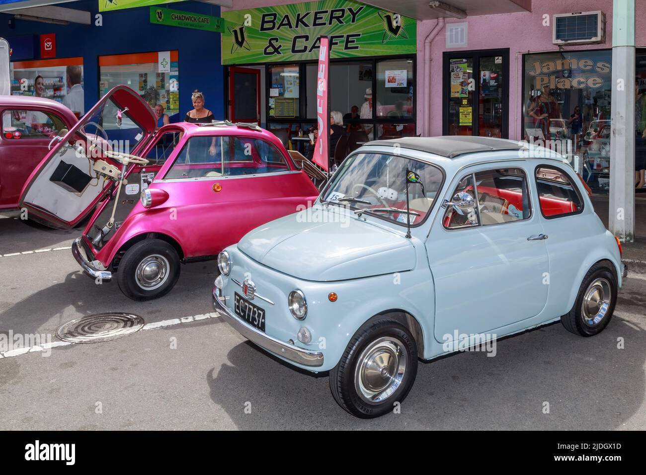 Two tiny 'bubble cars', a 1969 Fiat Saloon 500 (front) and 1963 BMW Isetta (rear) on display at a classic car show. Tauranga, New Zealand Stock Photo