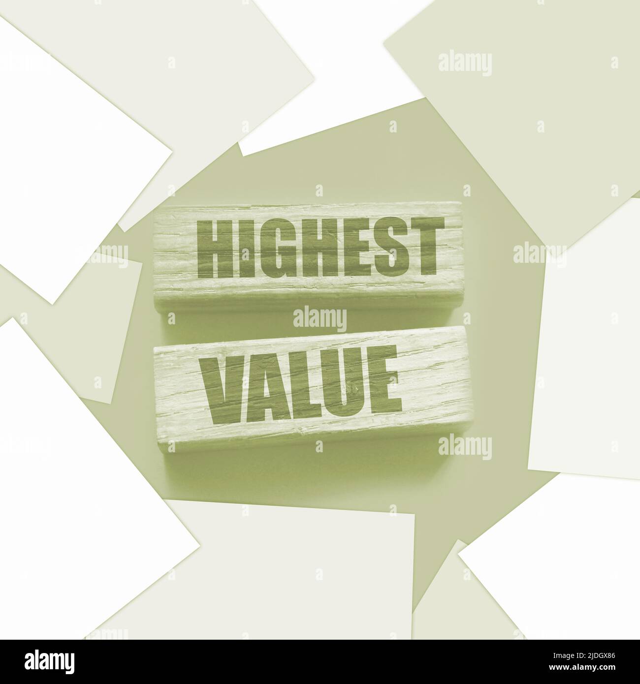 Highest values words on wooden building blocks isolated on yellow. Social, business and education concept. Stock Photo