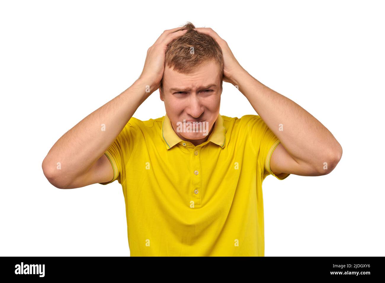 Upset man in yellow T-shirt clutched at his head, forgetful man with ...