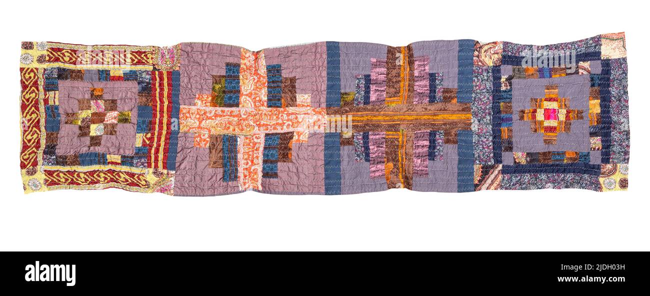 handcrafted crinkled silk patchwork scarf with geometric pattern cutout on white background Stock Photo