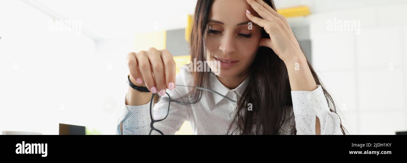 Tired overworked woman suffer with headache on workplace in office Stock Photo