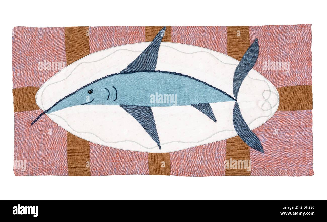 patchwork pillowcase with stitched happy swordfish cutout on white background Stock Photo