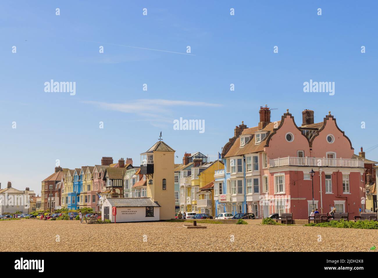 Colourful buildings facing the beach on a sunny day with blue sky. Aldeburgh, Suffolk. UK Stock Photo