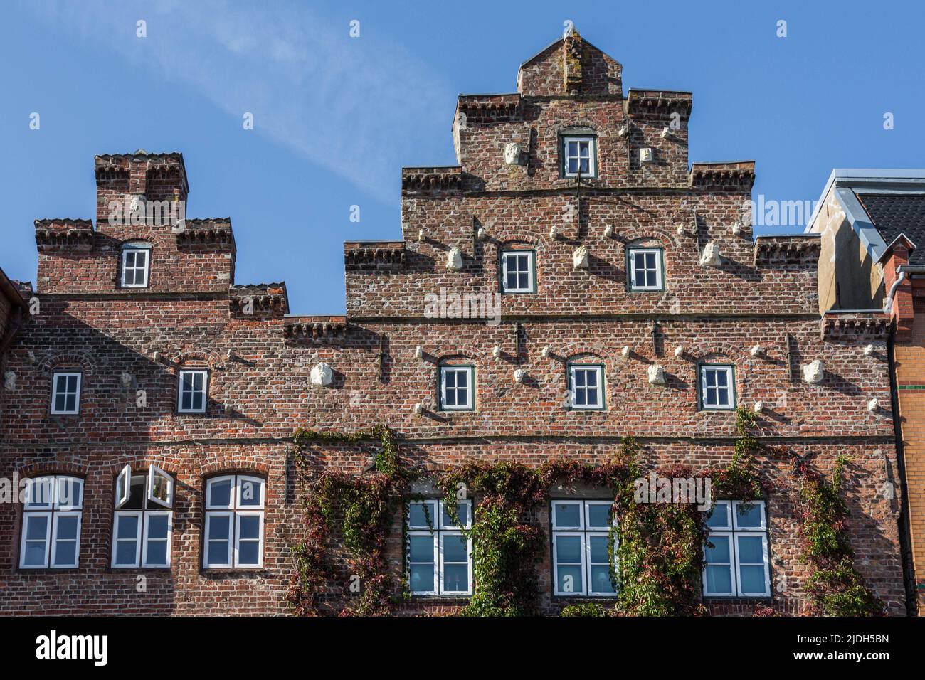Historic red brick facade with gable roof in Husum, North Frisia, Schleswig-Holstein, Germany Stock Photo