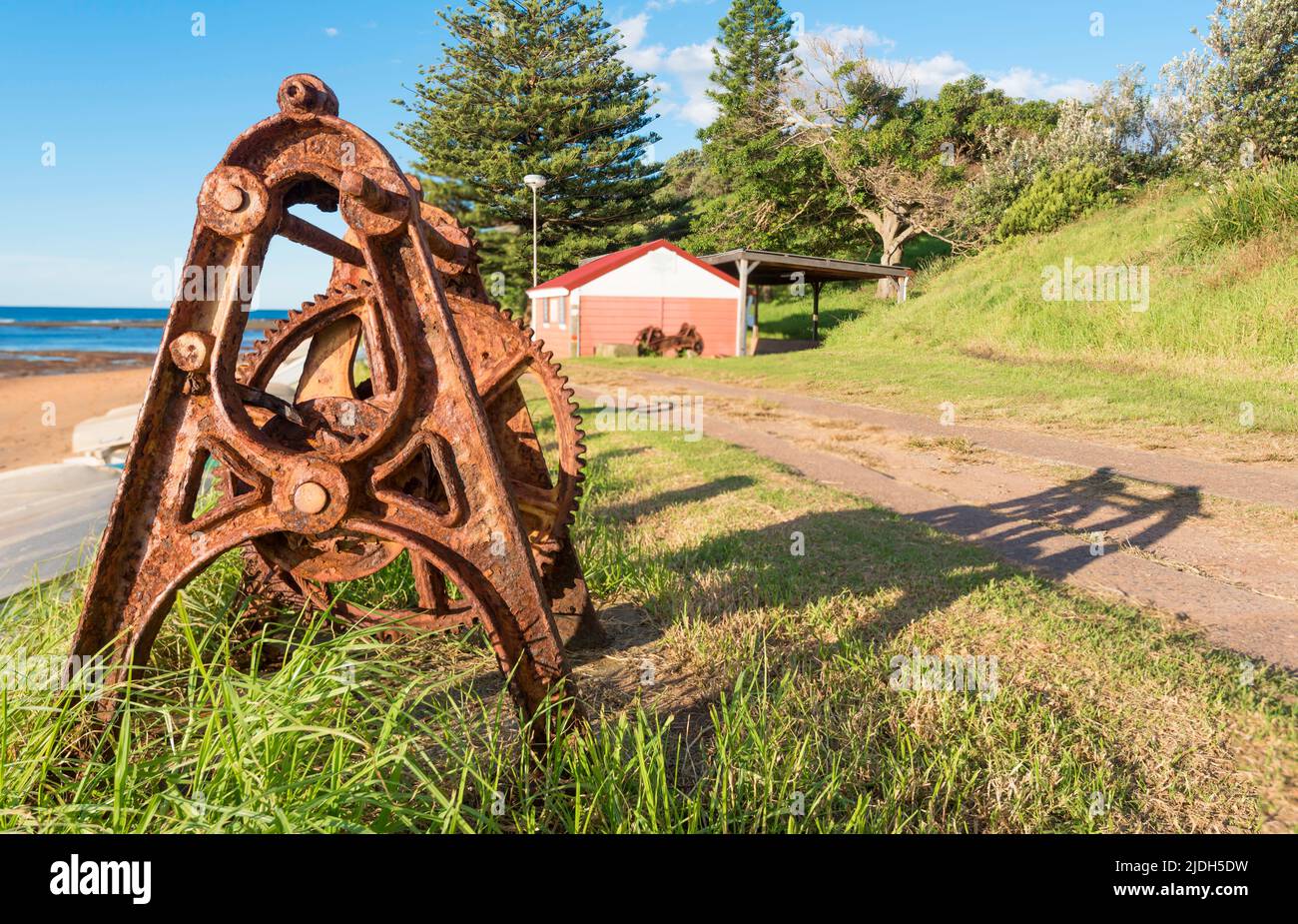 A rusted vintage boat winch formerly used to haul fishing boats ashore
