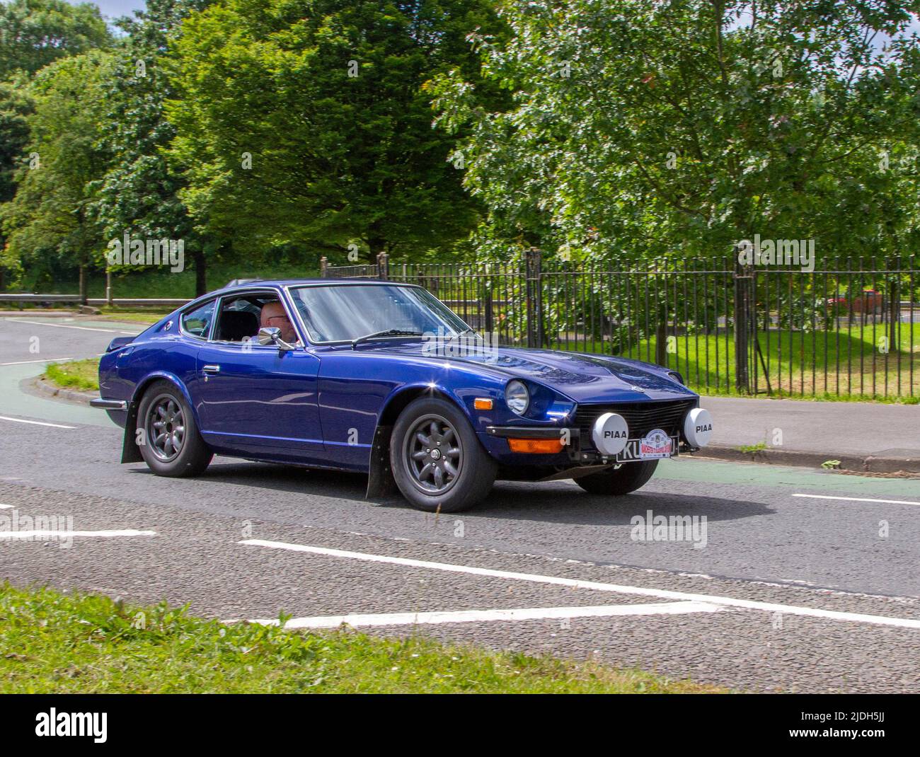 1971 70s seventies blue DATSUN 240Z sports coupe; automobiles featured during the 58th year of the Manchester to Blackpool Touring Assembly for Veteran, Vintage, Classic and Cherished cars. Stock Photo