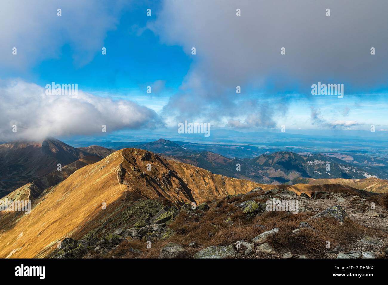 View from Jakubina hill summit in Western Tatras mountains in Slovakia during autumn day with blue sky and clouds Stock Photo