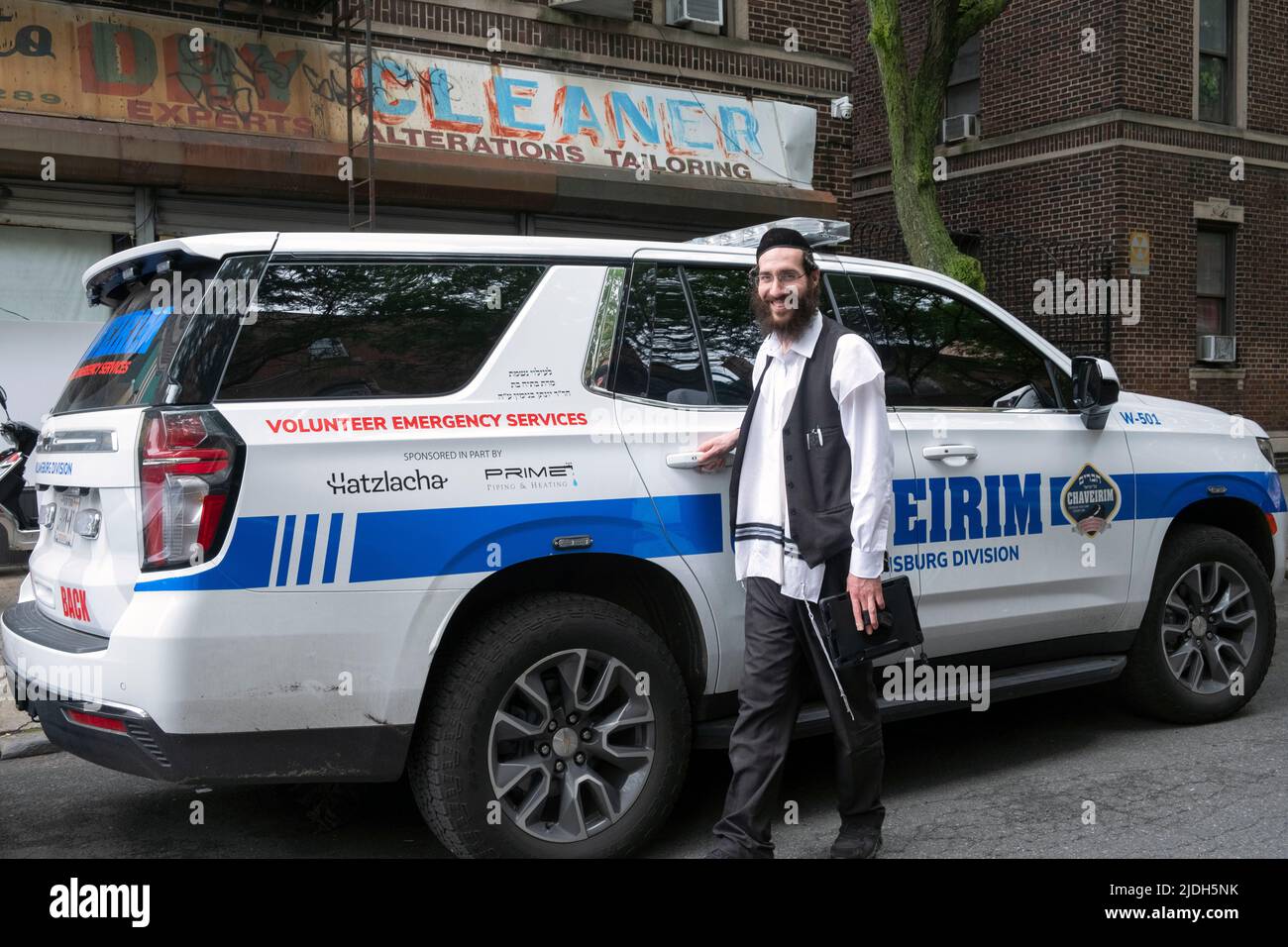 Posed portrait of a volunteer from Chaveirim (Hebrew for friends) who helps neighbors in need like lockouts, flats, battery boosts, etc. In Brooklyn. Stock Photo