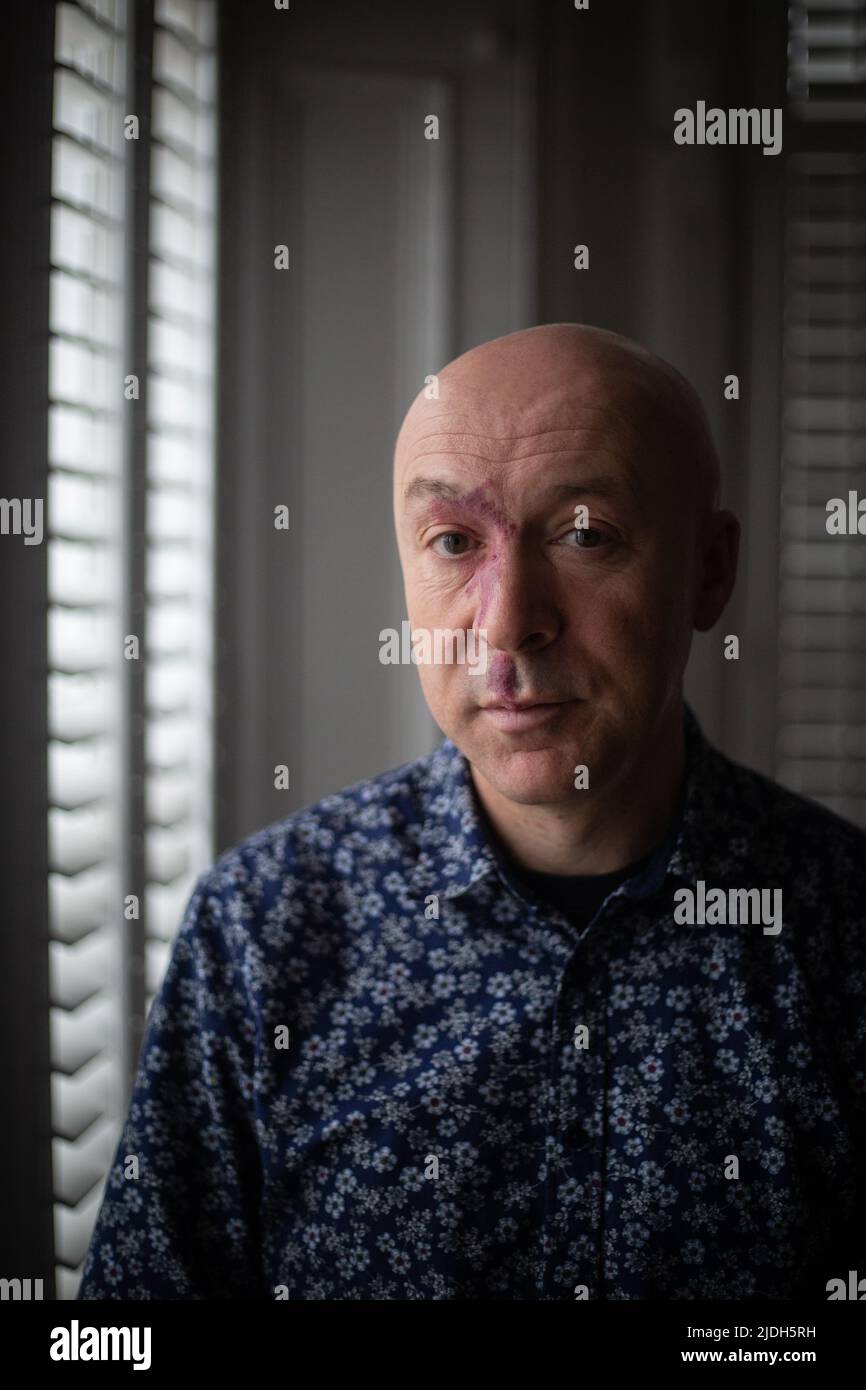 Christopher Brookmyre, author, in his home in Bothwell, Scotland, 2 March 2022. Stock Photo