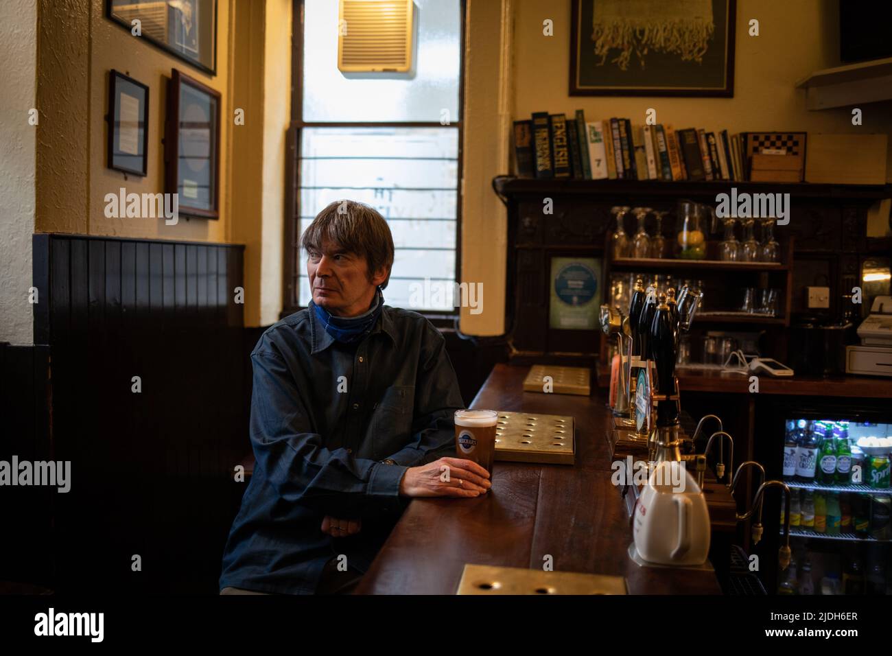 Ian Rankin, author, in The Oxford Bar, (a bar which features in many of his books), in Edinburgh, Scotland, 2 March 2022. Stock Photo