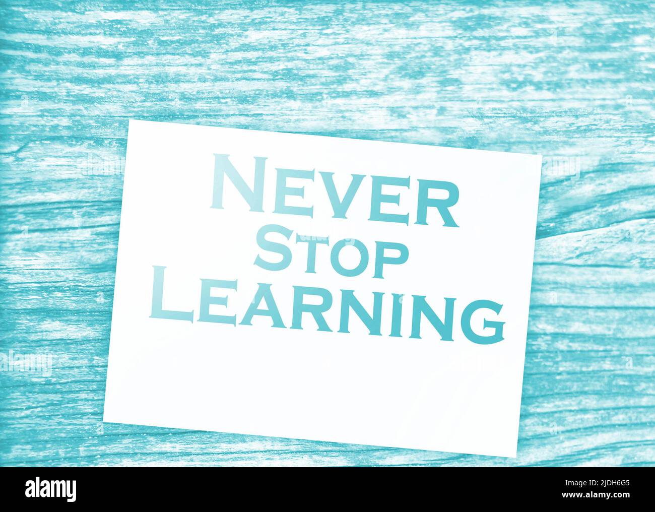 Text never stop learning on page and paper dollar signs around on ...