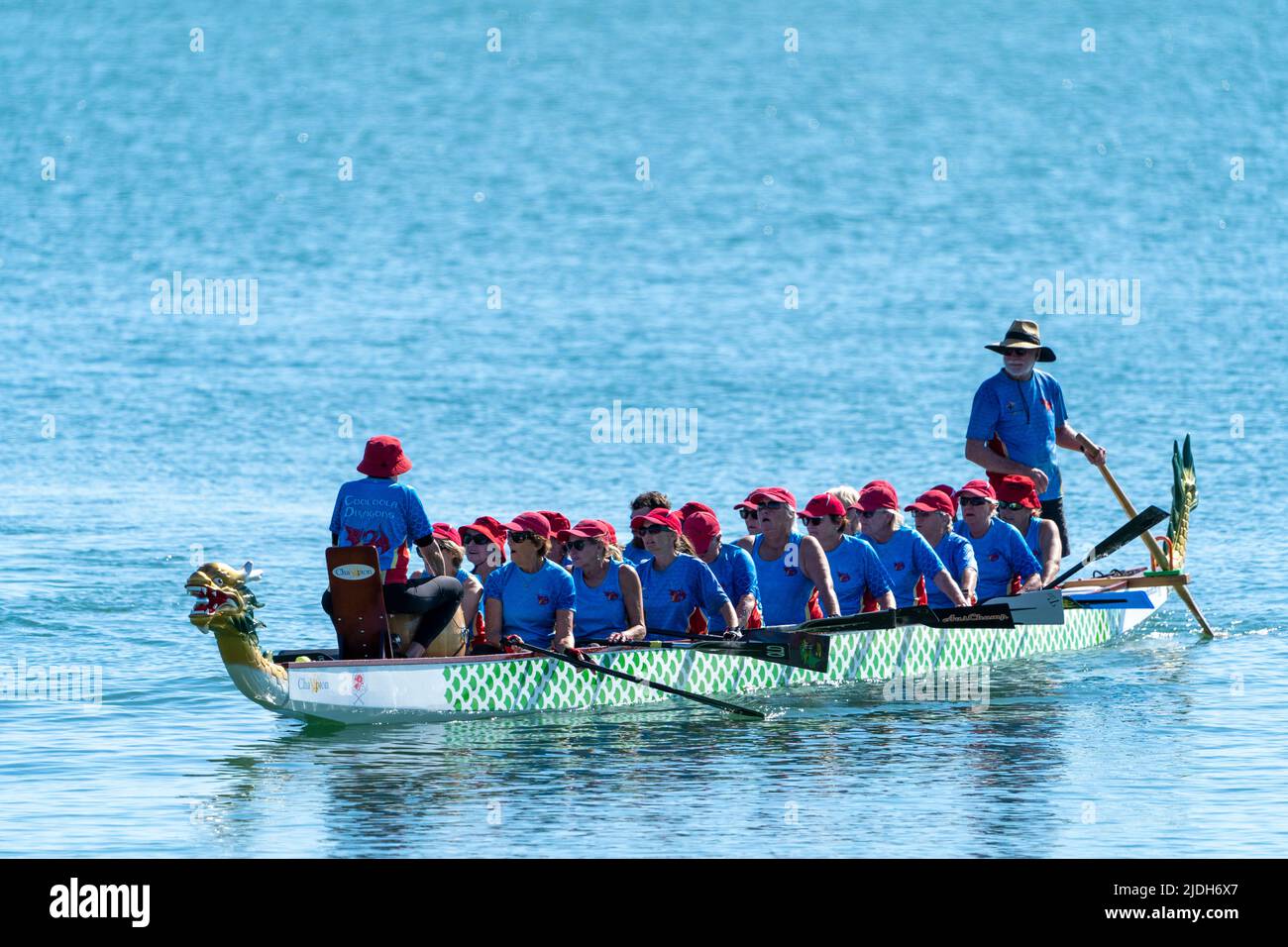 Dragon Boat paddling on calm water. Scarness Hervey Bay Queensland