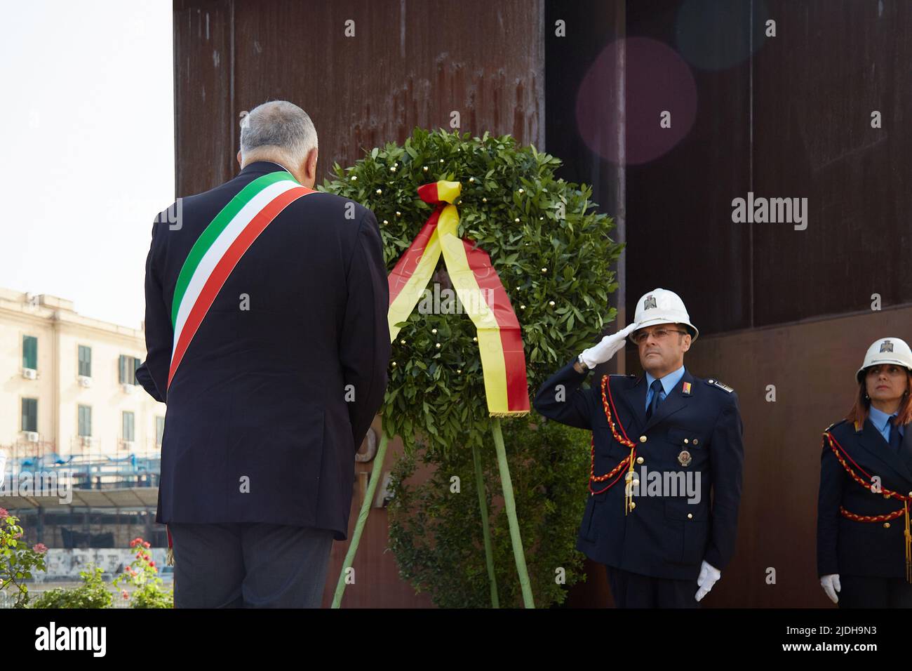 Palermo, Sicily, Italy. 21st June, 2022. First official act of ROBERTO LAGALLA as new mayor of Palermo.Lagalla placed a wreath of flowers in the monument dedicated to the victims of the Mafia in Piazza XIII Victime. At the same time, a group of demonstrators from the artistic and cultural movement Our Voice has gathered in front of the monument in dispute over the controversy for the support, during the election campaign, of Marcello Dell'Utri and TotÃ² Cuffaro, convicted of mafia.The demonstrators carried a banner reads ''Mayor Lagalla, before commemorating the victims of the Mafia, break Stock Photo