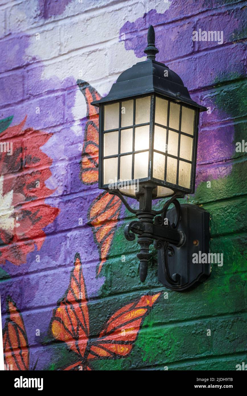 Illuminated Carriage Lamp - Painted Brick Wall - Lexington, Kentucky Stock Photo