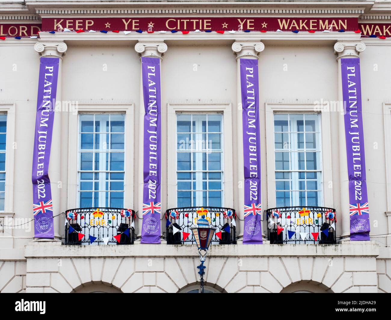 Platinum jubilee banners and flags on the Town Hall in Ripon North Yorkshire England Stock Photo
