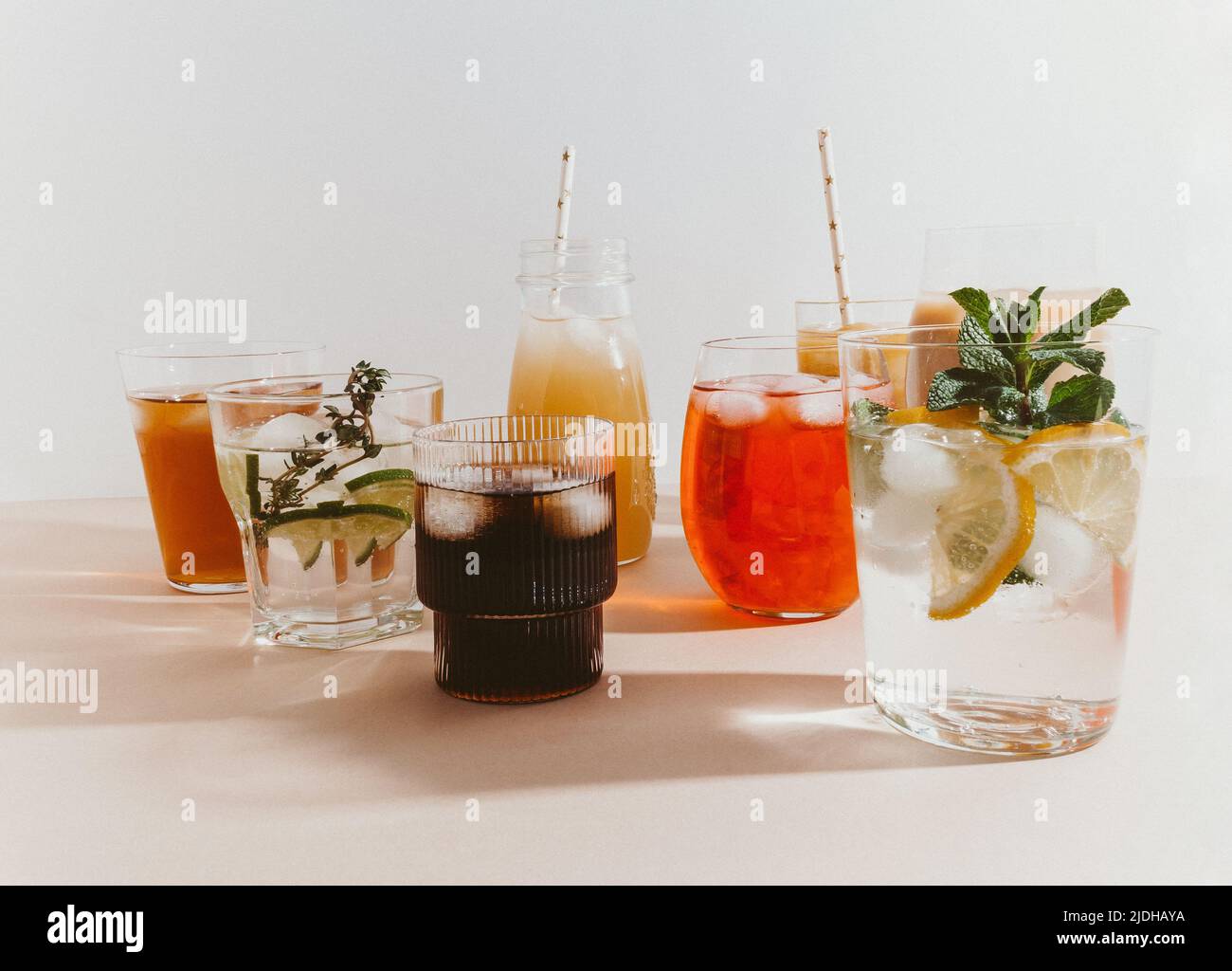Various refreshing nonalcoholic drinks in glasses with ice. Different