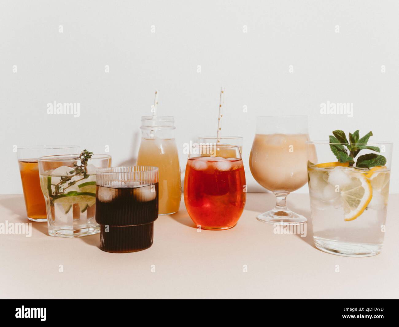 Various refreshing nonalcoholic drinks in glasses with ice. Different