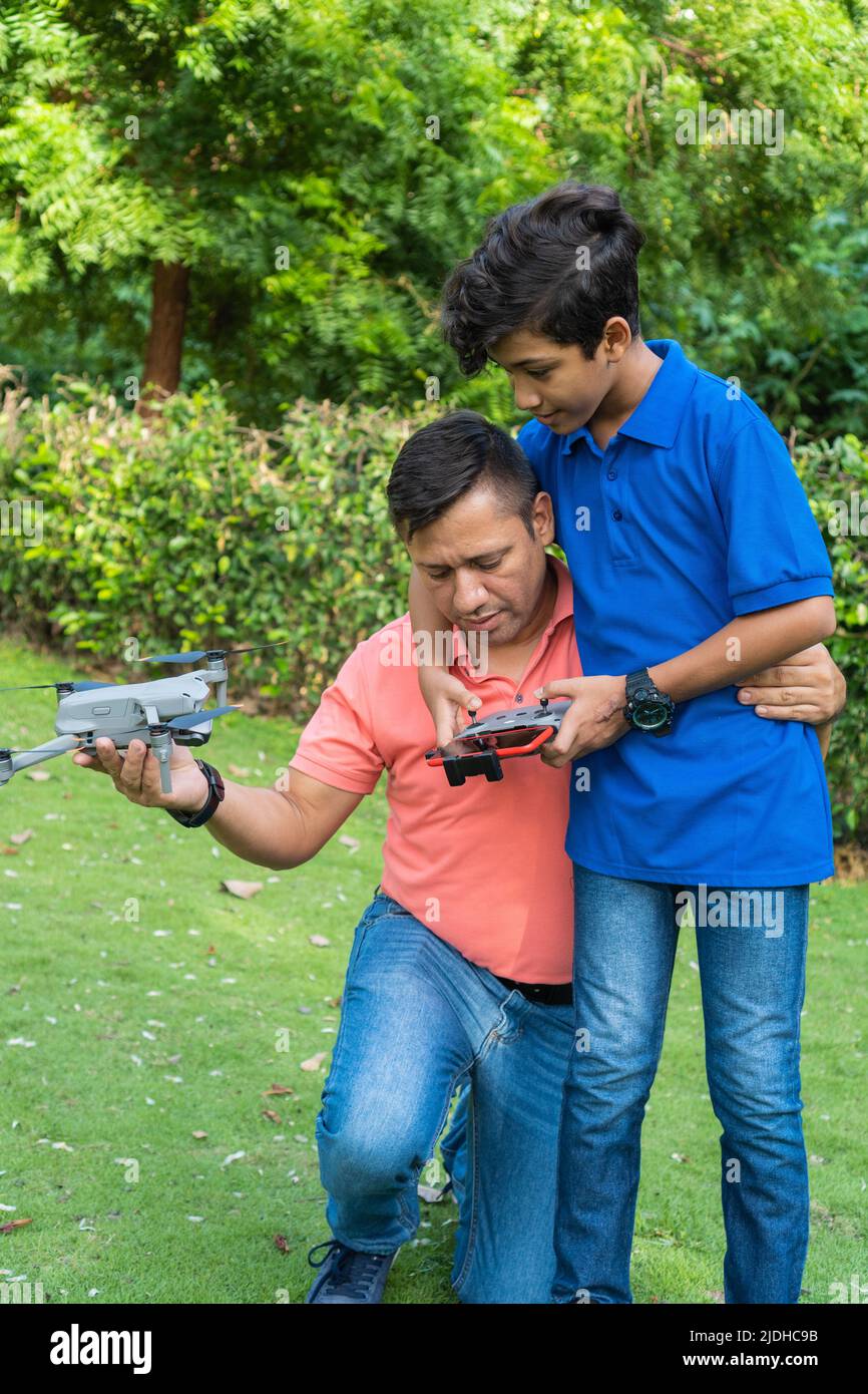 Latin Father and son with drone Stock Photo - Alamy