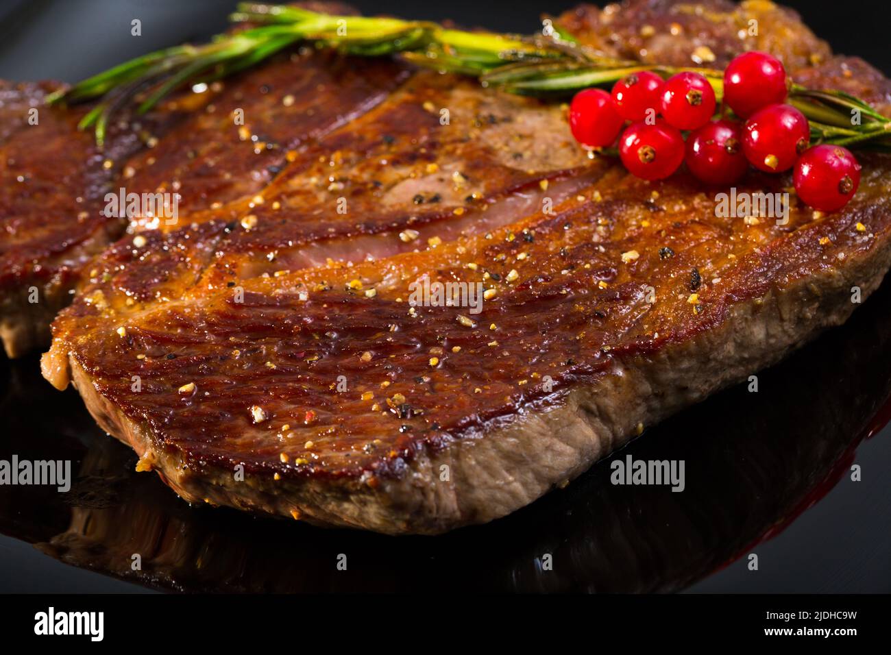 Roasted beef steak with rosemary and redcurrant Stock Photo Alamy